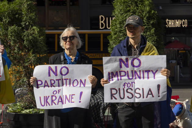 October 25, 2026, New York, New York, USA: Demonstrators stand in Times Square holding signs that read NO PARTITION OF UKRAINE! NO IMPUNITY for RUSSIA. New York USA - ZUMAr174 20261025_znp_r174_021 Copyright: xGinaxMxRandazzox