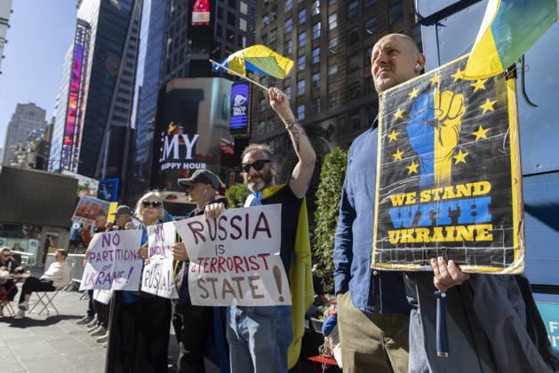 October 25, 2026, New York, New York, USA: Demonstrators in Times Square hold Ukrainian flags and signs that read WE STAND WITH UKRAINE RUSSIA is a TERRORIST New York! NO PARTITION OF UKRAINE! New York USA - ZUMAr174 20261025_znp_r174_024 Copyright: xGinaxMxRandazzox
