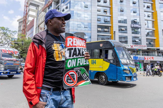 October 26, 2026, Nairobi, Kenya: Kenyan human rights activist holds a placard during the protest. Protesters demonstrated against rising fuel prices and the cost of living in Nairobi s Central Business District, calling for lower fuel prices and the removal of fuel taxes. Nairobi Kenya - ZUMAs197 20261026_aaa_s197_322 Copyright: xBonifacexMuthonix