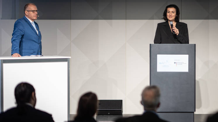 Dorothee Bär, Federal Minister for Research, Technology, and Space, and Andreas Tünnermann, Fraunhofer IOF, spokesperson for the QuNET Initiative, together on stage at the closing ceremony and presentation of the QuNET Initiative, a quantum communication network connecting Bavaria, Thuringia, and Berlin, Berlin, Germany, Futurium