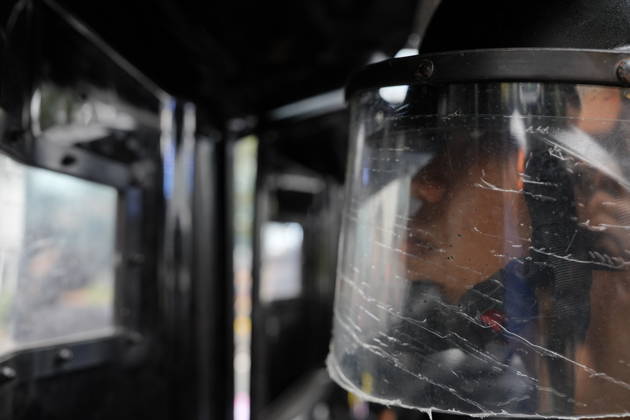 October 28, 2026, Jakarta, Indonesia: An Indonesian police officer is seen behind a scratched protective face shield as student protesters gather during a demonstration at Bundaran HI Jakarta Indonesia  - ZUMAm265 20261028_zip_m265_014 Copyright: xAndrixMunazirx