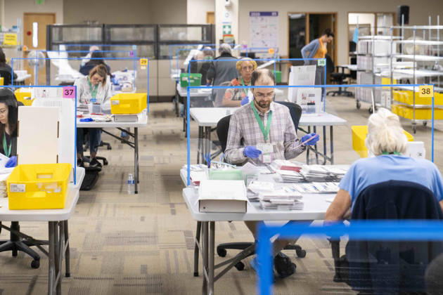October 29, 2026, Renton, Washington, USA: Workers open mail-in ballots in a secure room for the 2026 mid-term election at the King County Elections office in Renton, Washington, USA, on Thu., Oct. 29, 2026. Approximately 98% of votes cast in Washington state are mail-in ballots. Renton USA  - ZUMAb344 20261029_znp_b344_002 Copyright: xM.xScottxBrauerx