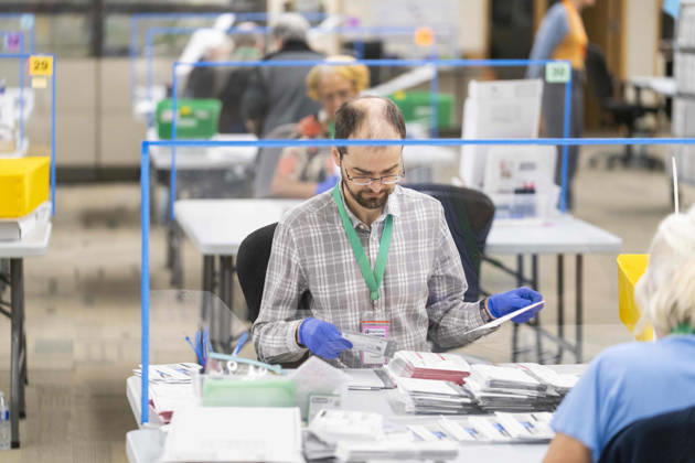 October 29, 2026, Renton, Washington, USA: Workers open mail-in ballots in a secure room for the 2026 mid-term election at the King County Elections office in Renton, Washington, USA, on Thu., Oct. 29, 2026. Approximately 98% of votes cast in Washington state are mail-in ballots. Renton USA  - ZUMAb344 20261029_znp_b344_003 Copyright: xM.xScottxBrauerx