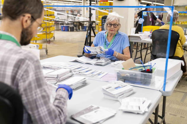 October 29, 2026, Renton, Washington, USA: Workers open mail-in ballots in a secure room for the 2026 mid-term election at the King County Elections office in Renton, Washington, USA, on Thu., Oct. 29, 2026. Approximately 98% of votes cast in Washington state are mail-in ballots. Renton USA  - ZUMAb344 20261029_znp_b344_034 Copyright: xM.xScottxBrauerx