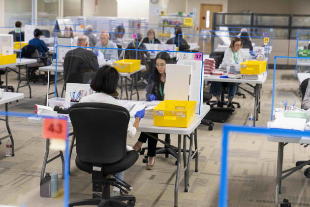 October 29, 2026, Renton, Washington, USA: Workers open mail-in ballots in a secure room for the 2026 mid-term election at the King County Elections office in Renton, Washington, USA, on Thu., Oct. 29, 2026. Approximately 98% of votes cast in Washington state are mail-in ballots. Renton USA - ZUMAb344 20261029_znp_b344_004 Copyright: xM.xScottxBrauerx