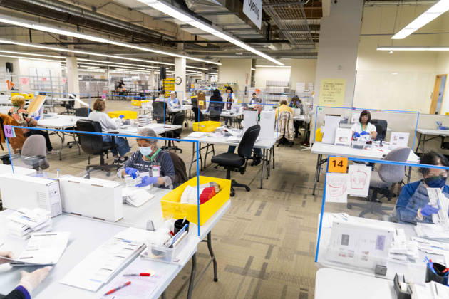 October 29, 2026, Renton, Washington, USA: Workers open mail-in ballots in a secure room for the 2026 mid-term election at the King County Elections office in Renton, Washington, USA, on Thu., Oct. 29, 2026. Approximately 98% of votes cast in Washington state are mail-in ballots. Renton USA - ZUMAb344 20261029_znp_b344_024 Copyright: xM.xScottxBrauerx
