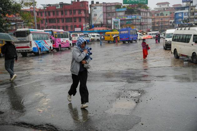 October 31, 2026, Lalitpur, Nepal: LALITPUR, NEPAL OCTOBER 31, 2026: People walk through the rain in Lalitpur as Cyclone Arnab, which originated in the Bay of Bengal, brings rainfall to the Kathmandu Valley. Nepal s National Disaster Risk Reduction and Management Authority (NDRRMA) issued a high-alert advisory for 29 to 31 October, urging people to remain on high alert. Lalitpur Nepal - ZUMAq101 20261031_zna_q101_002 Copyright: xSunilxPradhanx