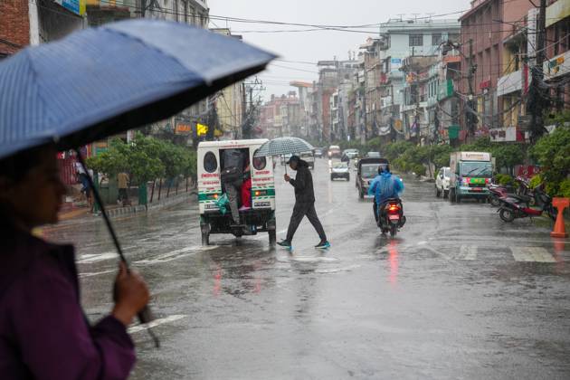 October 31, 2026, Lalitpur, Nepal: LALITPUR, NEPAL OCTOBER 31, 2026: People walk through the rain in Lalitpur as Cyclone Arnab, which originated in the Bay of Bengal, brings rainfall to the Kathmandu Valley. Nepal s National Disaster Risk Reduction and Management Authority (NDRRMA) issued a high-alert advisory for 29 to 31 October, urging people to remain on high alert. Lalitpur Nepal - ZUMAq101 20261031_zna_q101_004 Copyright: xSunilxPradhanx