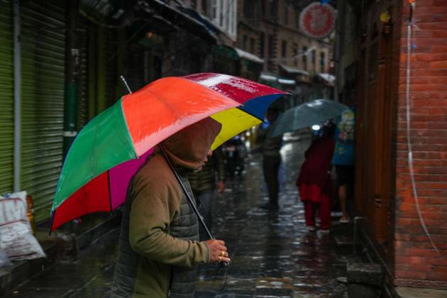 October 31, 2026, Lalitpur, Nepal: LALITPUR, NEPAL OCTOBER 31, 2026: People walk through the rain in Lalitpur as Cyclone Arnab, which originated in the Bay of Bengal, brings rainfall to the Kathmandu Valley. Nepal s National Disaster Risk Reduction and Management Authority (NDRRMA) issued a high-alert advisory for 29 to 31 October, urging people to remain on high alert. Lalitpur Nepal - ZUMAq101 20261031_zna_q101_006 Copyright: xSunilxPradhanx