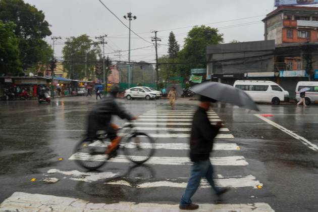 October 31, 2026, Lalitpur, Nepal: LALITPUR, NEPAL OCTOBER 31, 2026: People walk through the rain in Lalitpur as Cyclone Arnab, which originated in the Bay of Bengal, brings rainfall to the Kathmandu Valley. Nepal s National Disaster Risk Reduction and Management Authority (NDRRMA) issued a high-alert advisory for 29 to 31 October, urging people to remain on high alert. Lalitpur Nepal - ZUMAq101 20261031_zna_q101_007 Copyright: xSunilxPradhanx