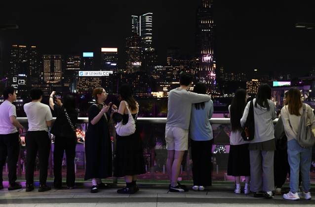 Hong Kong Daily Life Visitors watching night view of Victoria Harbour during Halloween day at Wan Chai on October 31, 2026 in Hong Kong. (Photo by Kobe Li Nexpher Images) Hong Kong