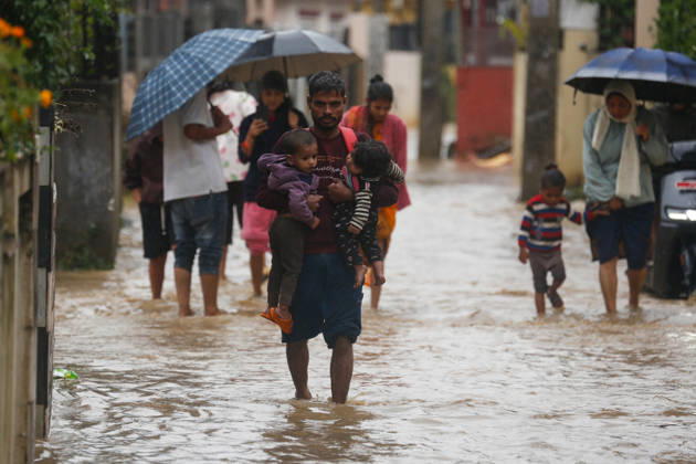 Flooding Disrupts Daily Life In Lalitpur Amid Heavy Rainfall Pedestrians wade through flooded streets amid continuous rainfall caused by Cyclone Arnab in Lalitpur, Nepal, on October 31, 2026. Heavy rainfall has inundated several areas, disrupting daily activities and making movement difficult for pedestrians and motorists. Lalitpur Nepal  Copyright: xSanjitxPariyarx originalFilename: pariyar-notitle261031_npBw1.jpg