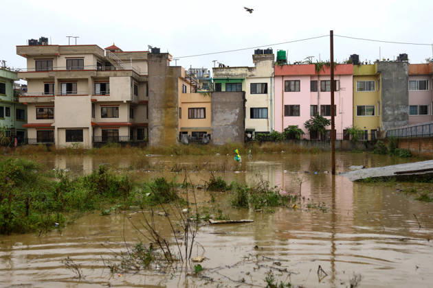 Cyclone Arnab s Impact: Continuous Rainfall Disrupts Daily Life Across Kathmandu Valley Buildings are surrounded by floodwater after the Karmanasa River overflowed into residential areas in Imadol, Lalitpur, Nepal, on October 31, 2026. Continuous rainfall has caused flooding in nearby roads and settlements. Lalitpur Bagmati Nepal  Copyright: xSubaasxShresthax originalFilename: shrestha-cyclonea261031_npGPN.jpg