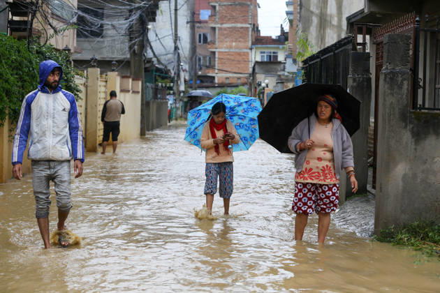 Cyclone Arnab s Impact: Continuous Rainfall Disrupts Daily Life Across Kathmandu Valley People walk through floodwater in a residential area in Imadol, Lalitpur, Nepal, on October 31, 2026, after the Karmanasa River overflowed. The flooding has affected daily activities and made movement difficult for local residents. Lalitpur Bagmati Nepal  Copyright: xSubaasxShresthax originalFilename: shrestha-cyclonea261031_npZBf.jpg