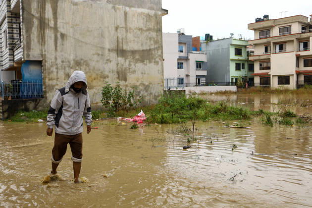 Cyclone Arnab s Impact: Continuous Rainfall Disrupts Daily Life Across Kathmandu Valley A man walks through floodwater in Imadol, Lalitpur, Nepal, on October 31, 2026, after water from the overflowing Karmanasa River entered nearby settlements. Continuous rainfall has inundated roads and residential areas, disrupting daily life and movement. Lalitpur Bagmati Nepal  Copyright: xSubaasxShresthax originalFilename: shrestha-cyclonea261031_npQSG.jpg