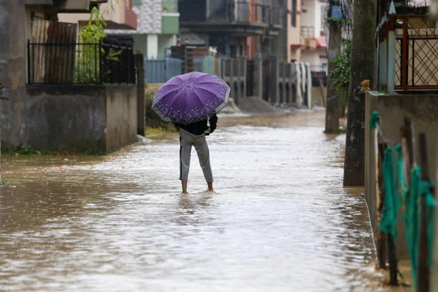Cyclone Arnab s Impact: Continuous Rainfall Disrupts Daily Life Across Kathmandu Valley A man walks through floodwater in Imadol, Lalitpur, Nepal, on October 31, 2026, after water from the overflowing Karmanasa River entered nearby settlements. Continuous rainfall has inundated roads and residential areas, disrupting daily life and movement. Lalitpur Bagmati Nepal  Copyright: xSubaasxShresthax originalFilename: shrestha-cyclonea261031_npxgd.jpg